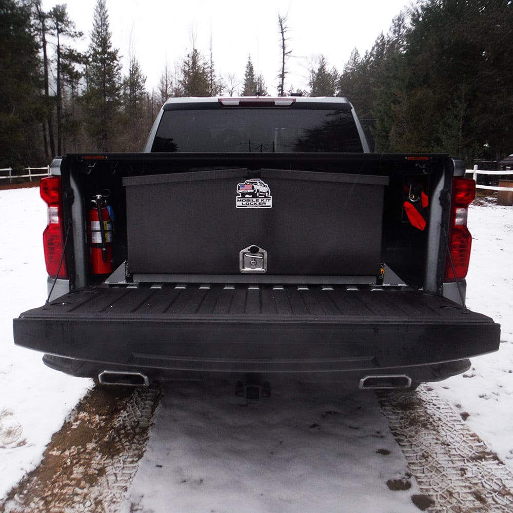 Mobile Kit Locker mounted in truck, rear view with MK decal